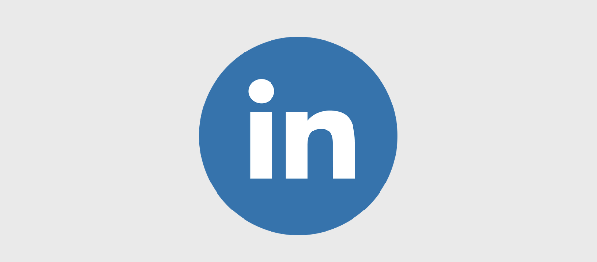 The LinkedIn logo displaying a white "in" inside a solid blue circle, set against a light gray background.