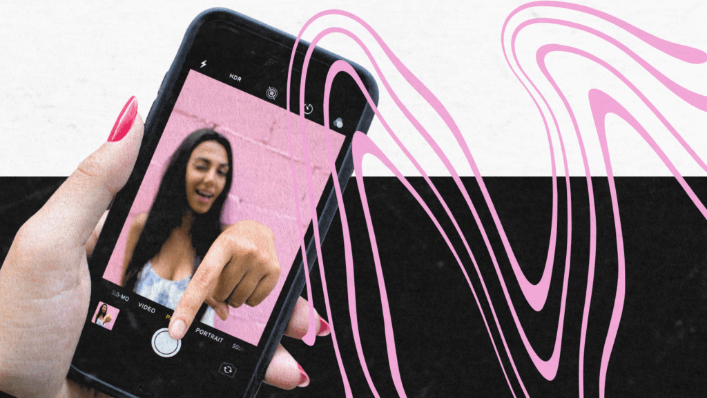 A close-up of a hand with pink nails holding a smartphone recording a woman in front of a pink wall, overlaid with abstract pink wavy lines on a black-and-white background.