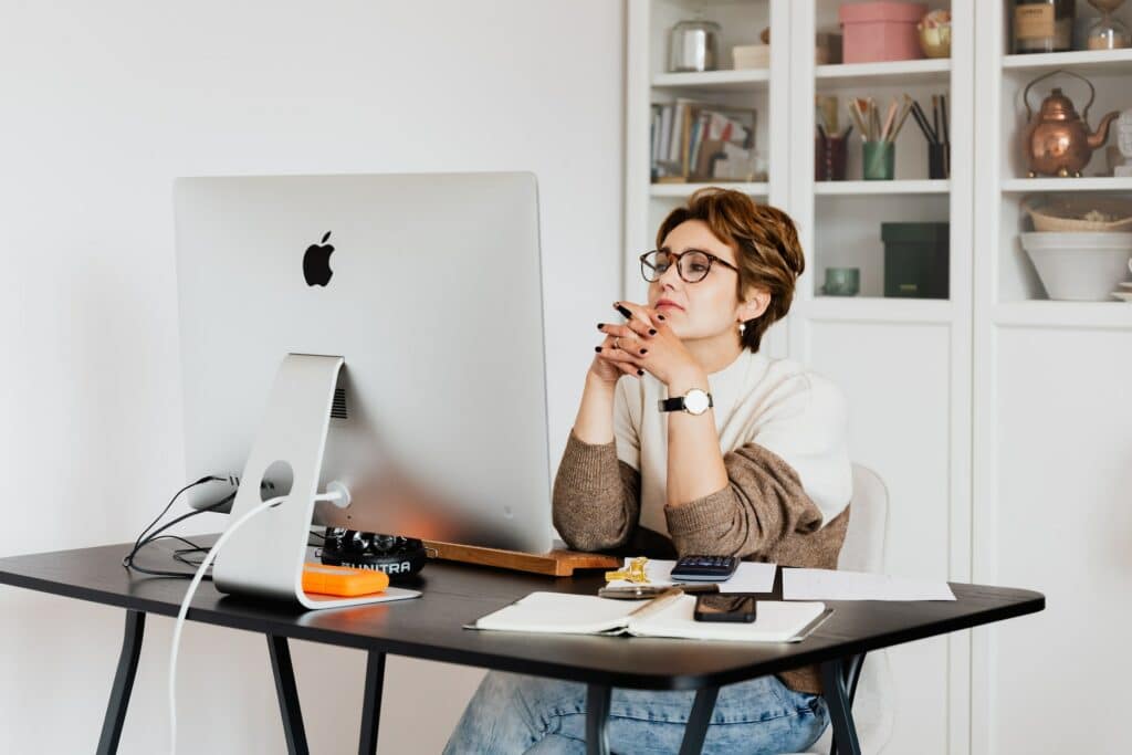 Woman sitting in front of computer