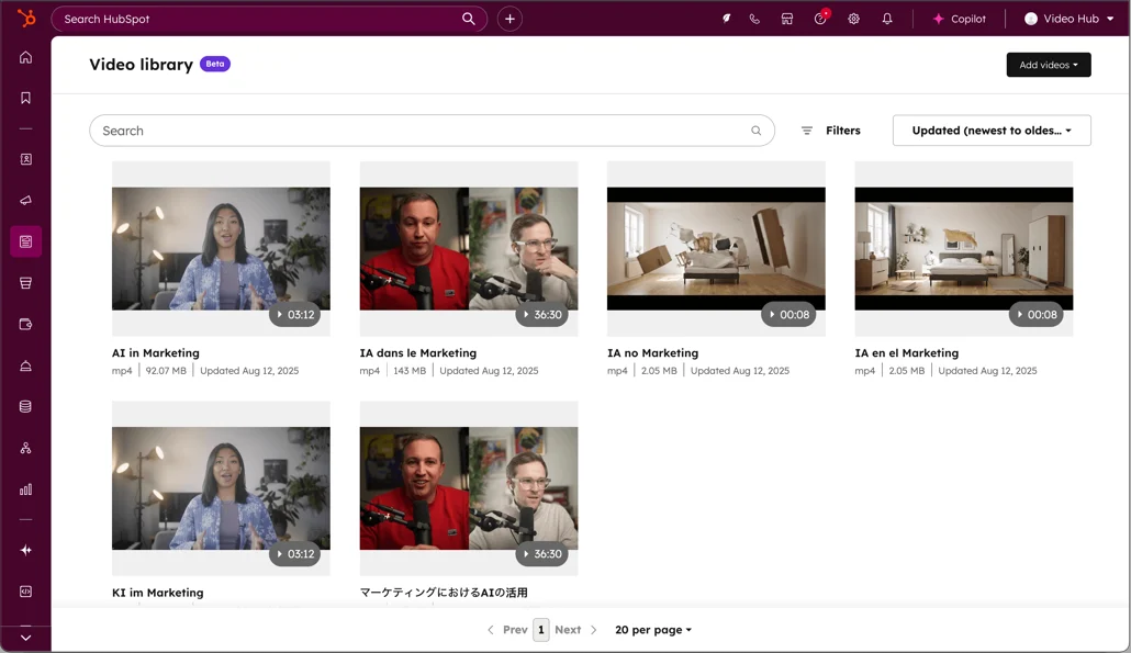 HubSpot video library showing marketing content in multiple languages including AI in Marketing videos with upload dates and file sizes.