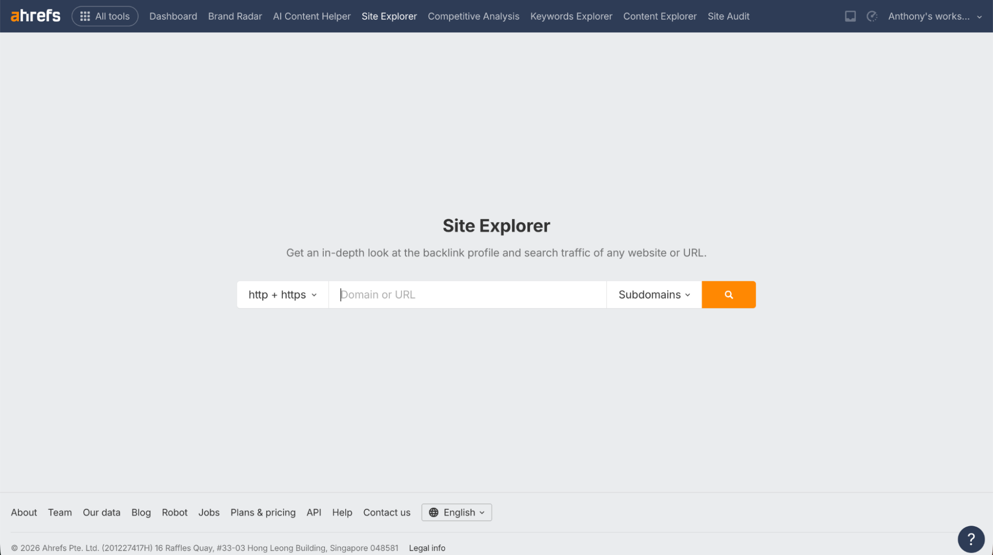 The Ahrefs Site Explorer tool landing page featuring a central search bar for domain or URL backlink and traffic analysis.