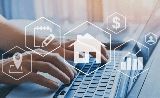 Hands typing on a laptop with overlayed icons representing real estate SEO services, including a house, location pin, and analytics graph