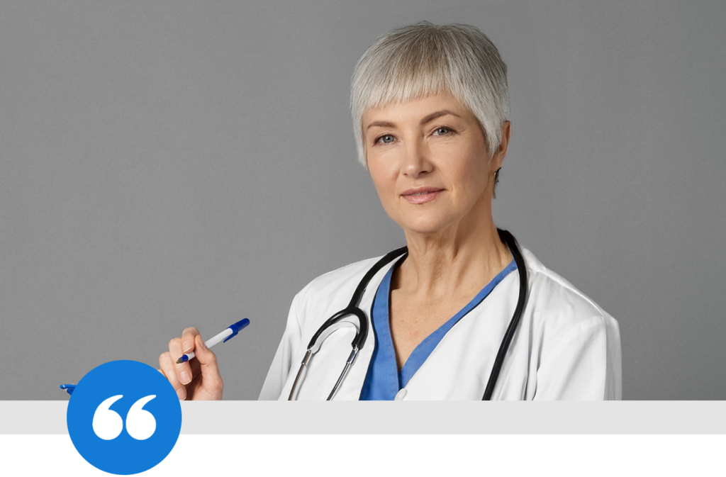 Portrait of Dr. Emily Rios with short gray hair, wearing a white medical coat.
