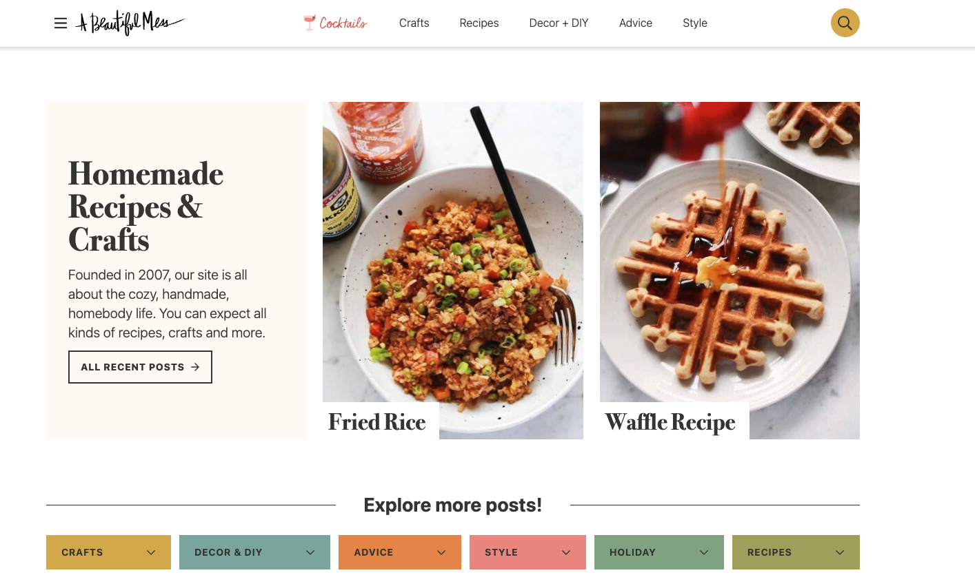 Homepage screenshot of A Beautiful Mess blog showing colorful food images and navigation categories like crafts, decor, and recipes.