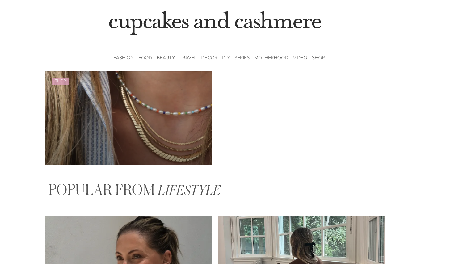 Screenshot of the Cupcakes and Cashmere lifestyle blog featuring jewelry, fashion, and home inspiration content in a clean, stylish layout.