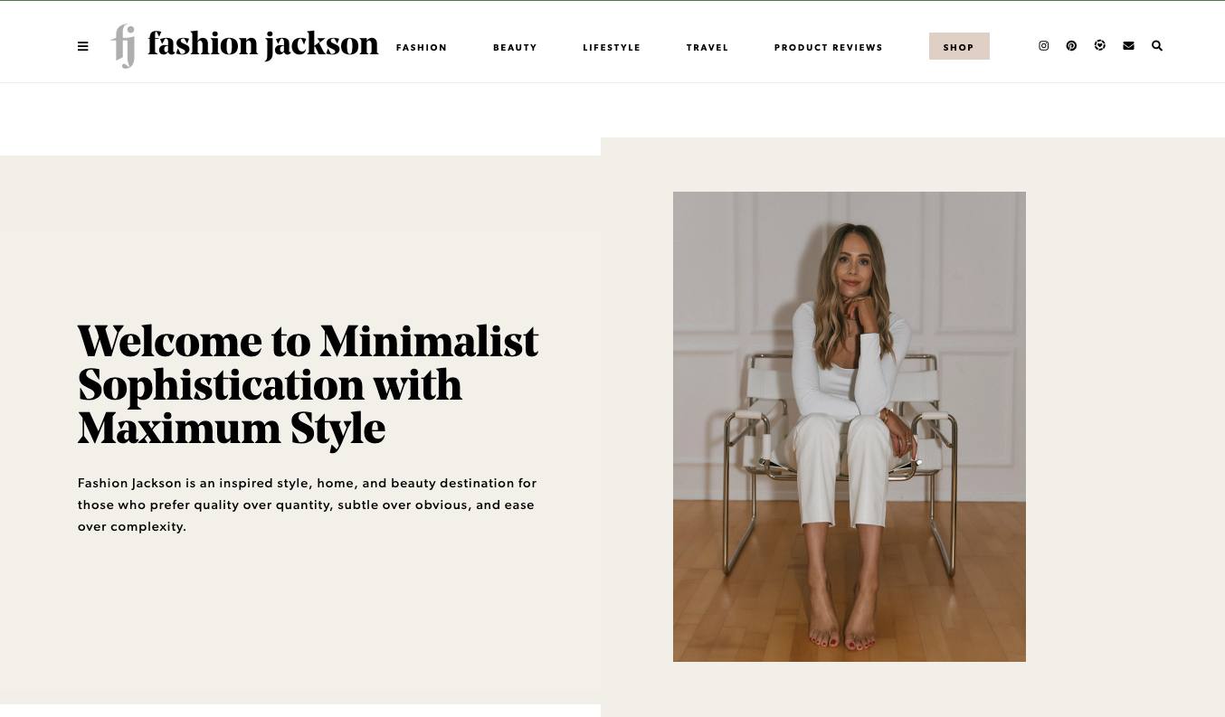 Screenshot of Fashion Jackson's homepage with a clean layout featuring Amy Jackson seated in a neutral-toned room, highlighting minimalist style and daily outfit inspiration.