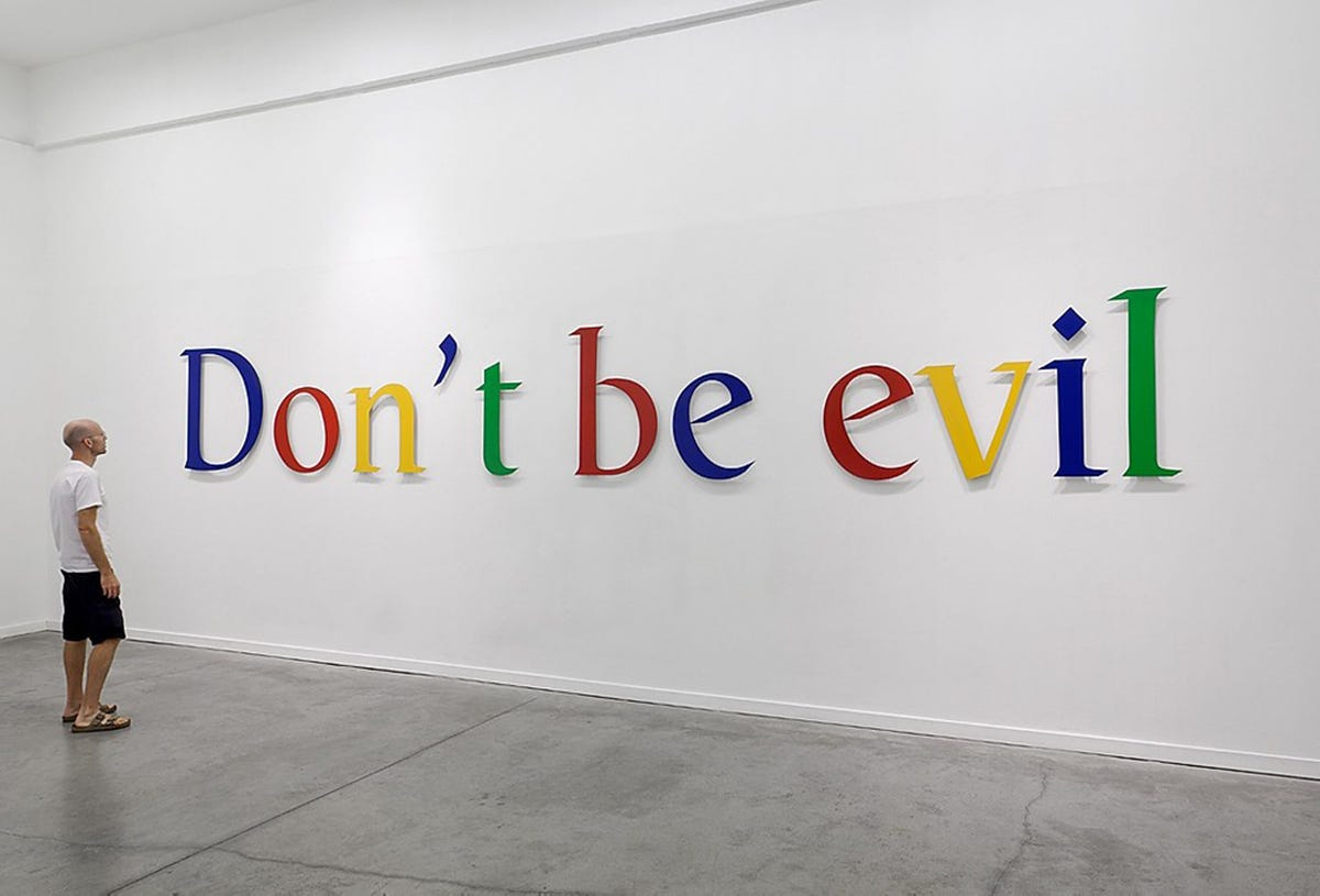Wall art installation spelling out 'Don’t be evil' in Google’s signature colors, symbolizing a values-based famous slogan tied to ethical brand identity.