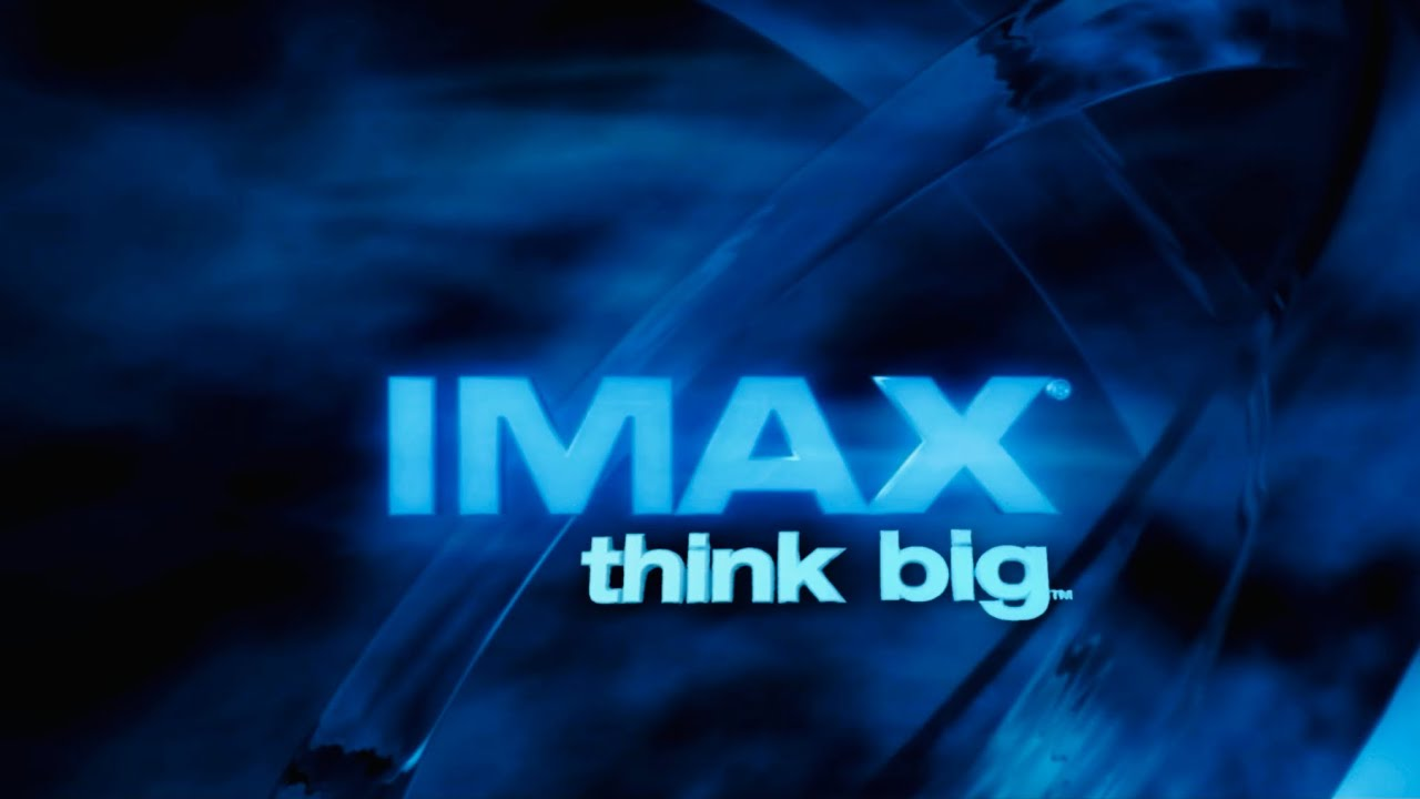 IMAX logo with the slogan 'Think big' over a cinematic blue background, representing a bold and visionary famous slogan that aligns with big-screen experiences.