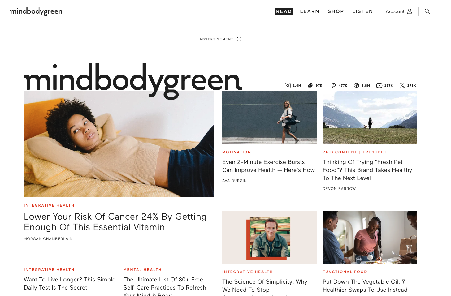 Homepage of Mindbodygreen featuring expert articles on mental wellness, functional food, and integrative health, with a clean, magazine-style layout.