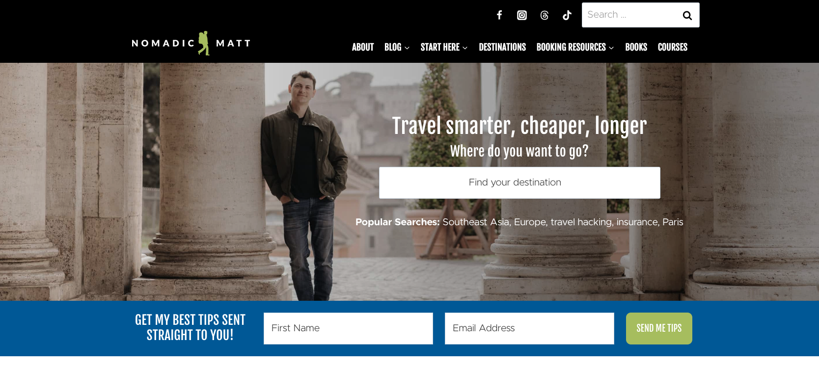 Homepage of Nomadic Matt featuring a travel search bar and sign-up form for travel tips. The design highlights budget travel resources, with Matt Kepnes standing between stone columns.