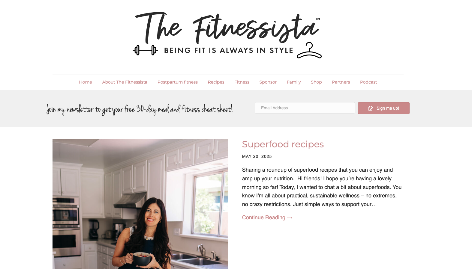 Homepage of The Fitnessista featuring Gina Harney in a kitchen next to a recipe post, blending fitness tips, nutrition, and family lifestyle.