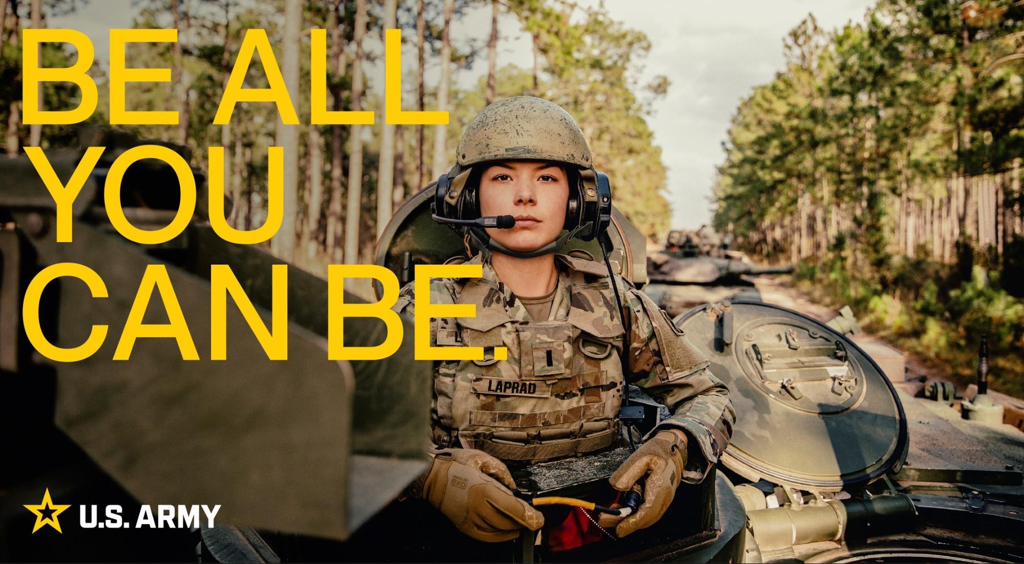 U.S. Army soldier in front of military vehicles with the slogan 'Be All You Can Be,' representing a powerful, motivational, and iconic famous slogan.