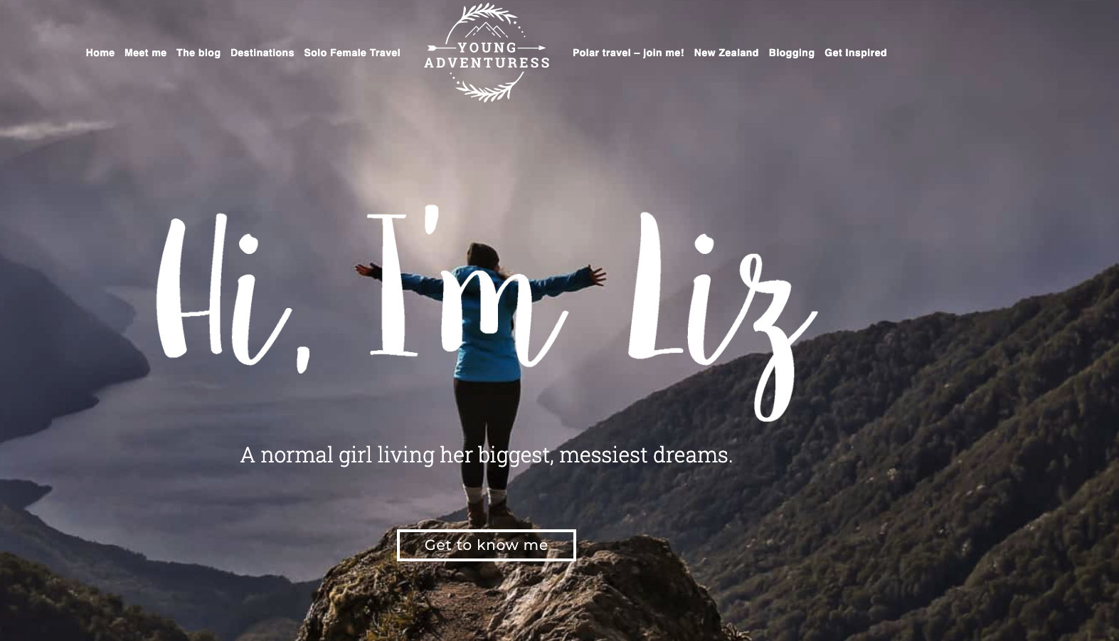 Homepage screenshot of the Young Adventuress blog by Liz Carlson, featuring a photo of a woman standing in front of mountains with the text "Hi, I'm Liz" overlayed.