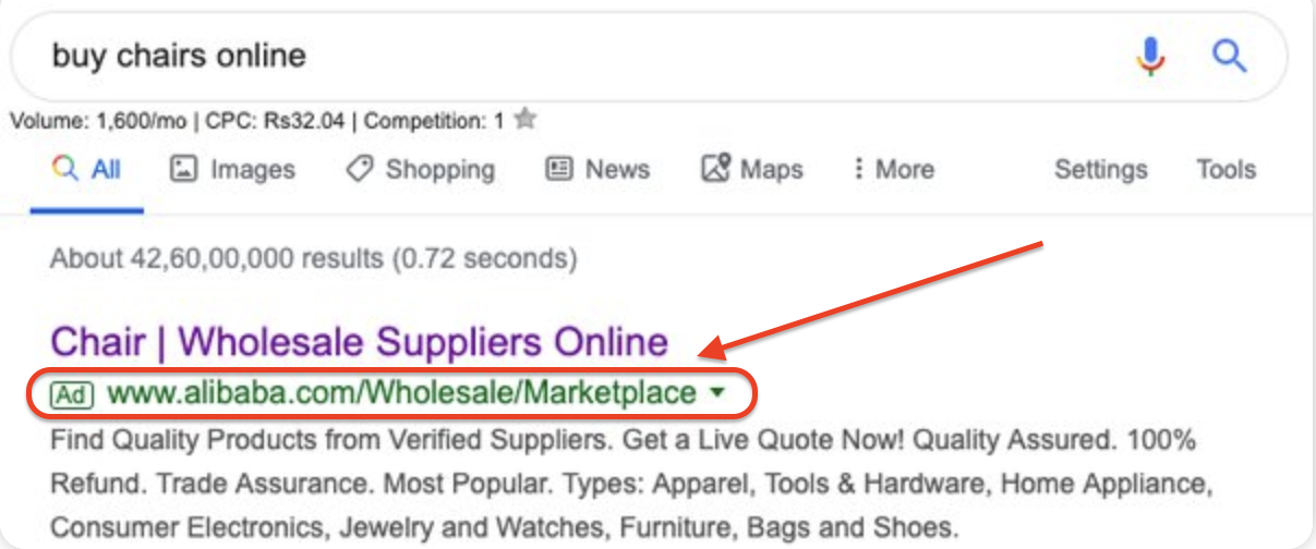 This image shows a Google search result for the query “buy chairs online,” displaying a sponsored ad at the top. The highlighted link is for Alibaba, labeled as an advertisement with the URL “www.alibaba.com/Wholesale/Marketplace.” The link is outlined with a red arrow and box to emphasize the structure and visibility of paid search results.