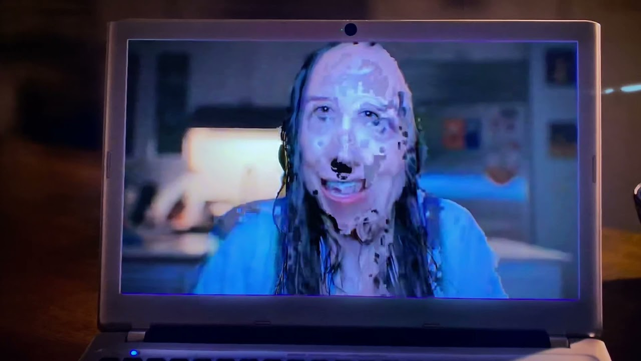 Blurry laptop screen showing a creepy trailer from AT&T’s horror-style commercial that turns out to be about kids bored in the car.