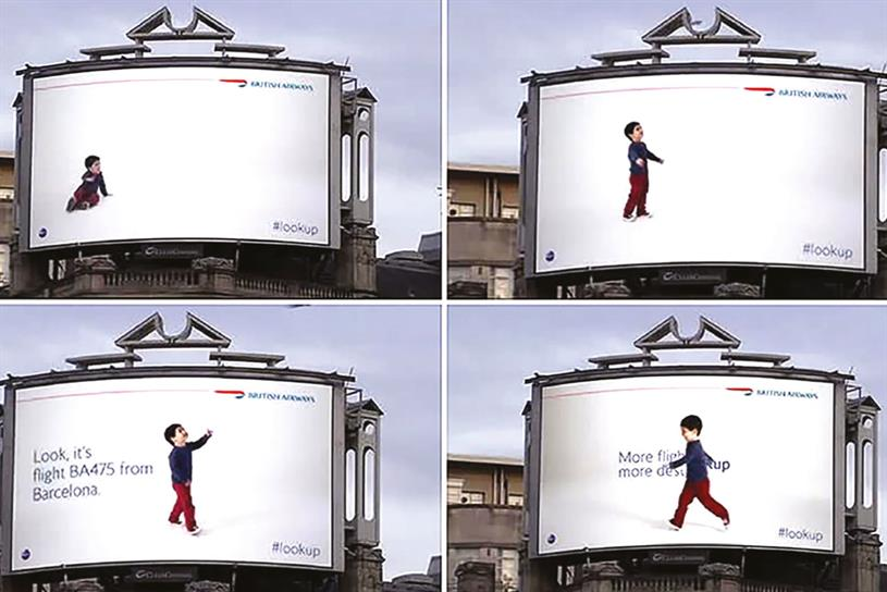 Digital billboard with a child pointing to real planes flying overhead as part of British Airways’ live flight-tracking campaign.