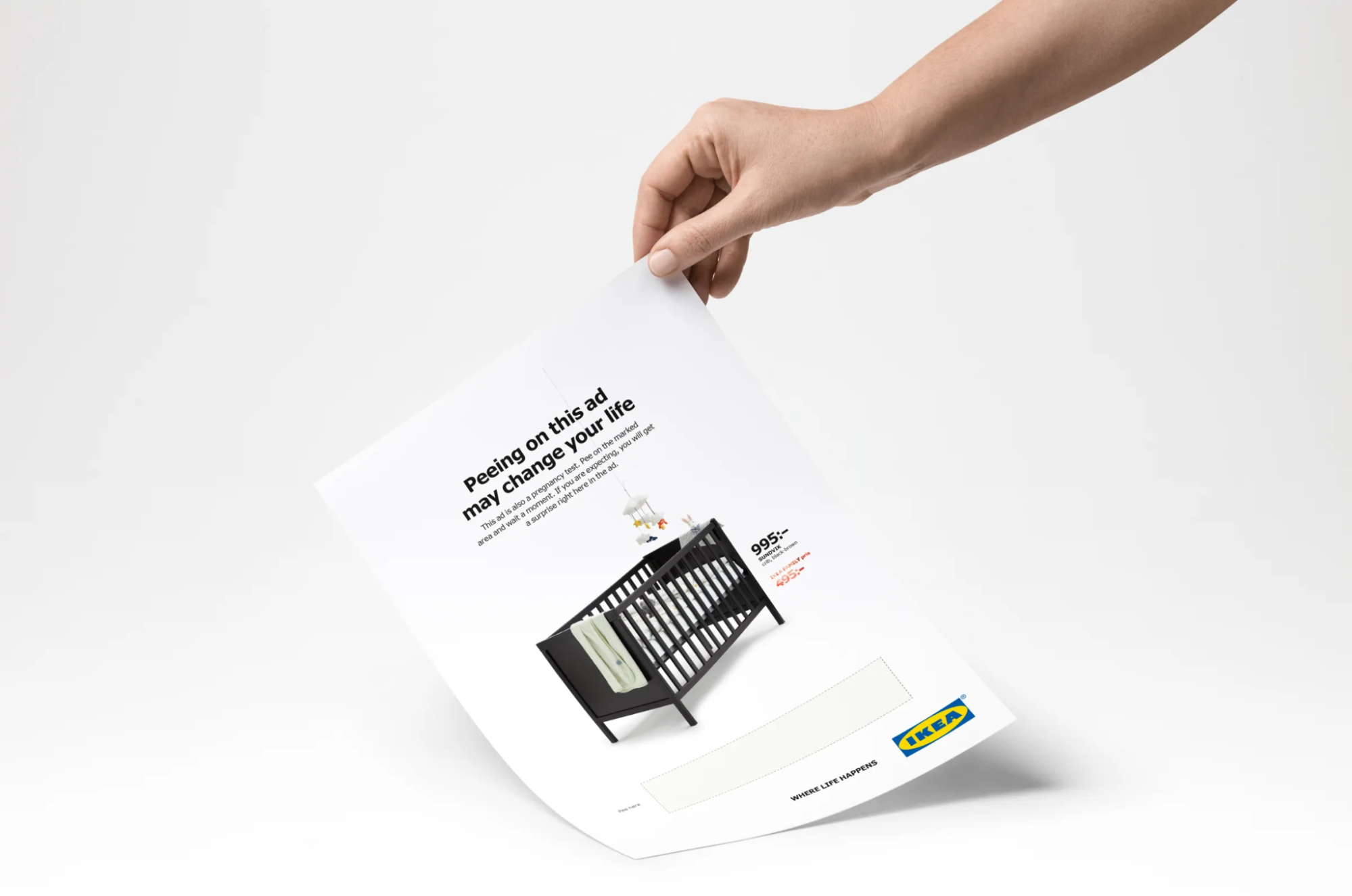 IKEA print ad encouraging pregnant users to pee on the paper to reveal a baby crib discount, showcasing rule-breaking creativity.