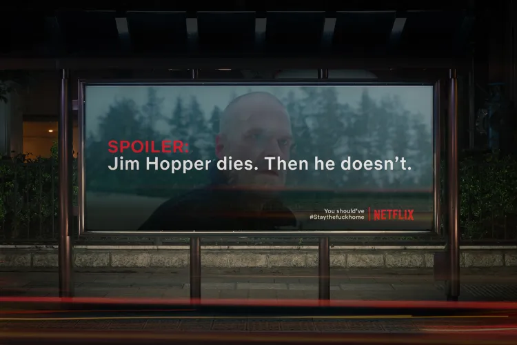 Netflix billboard ad with a fake spoiler for “Stranger Things” as part of the Spoiler Billboard campaign encouraging binge-watching.