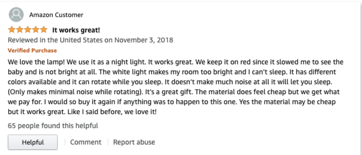 Amazon customer review for a night light lamp, rated 5 stars and titled “It works great!” The reviewer praises its red light for nighttime use, mentions the rotating feature, and acknowledges the material feels cheap but still considers it a great value.