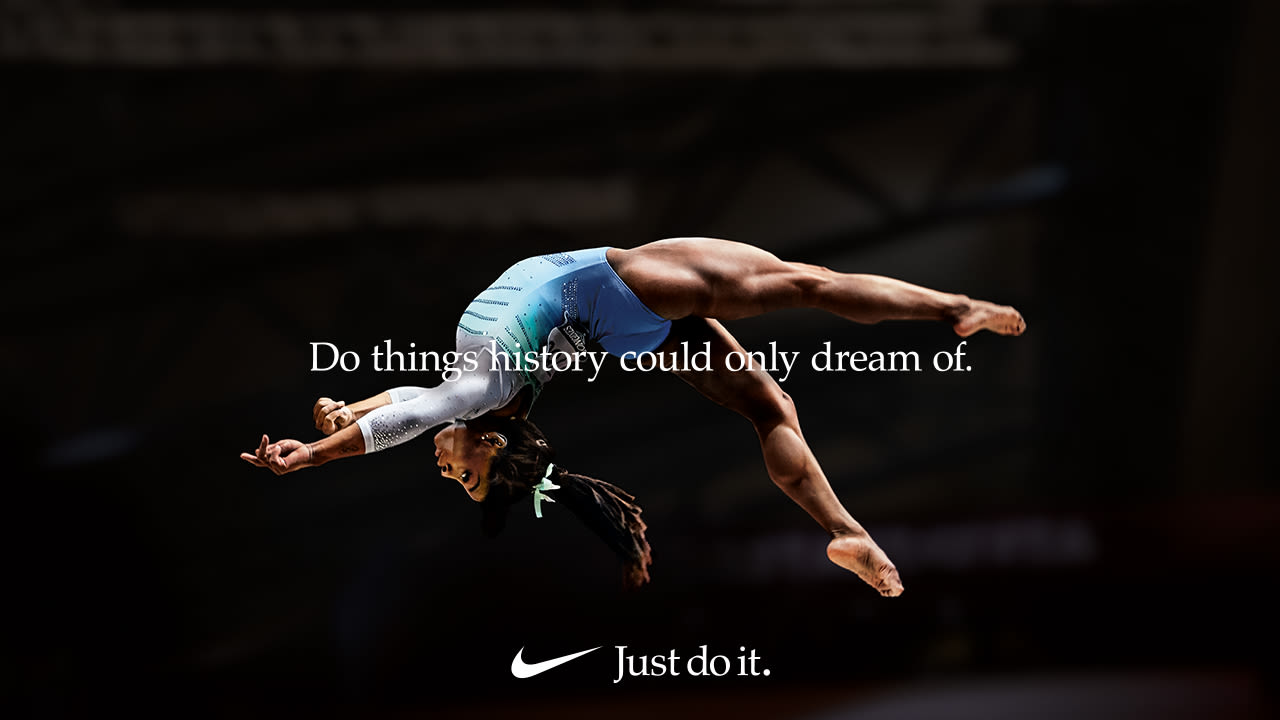 Female gymnast mid-air in Nike’s “Dream Crazier” ad, celebrating women athletes and challenging gender bias.