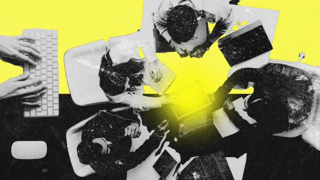 A top-down view of a diverse team collaborating around a laptop in a digital workspace, highlighted with a bold yellow background. The scene evokes creativity and teamwork in a modern office setting.