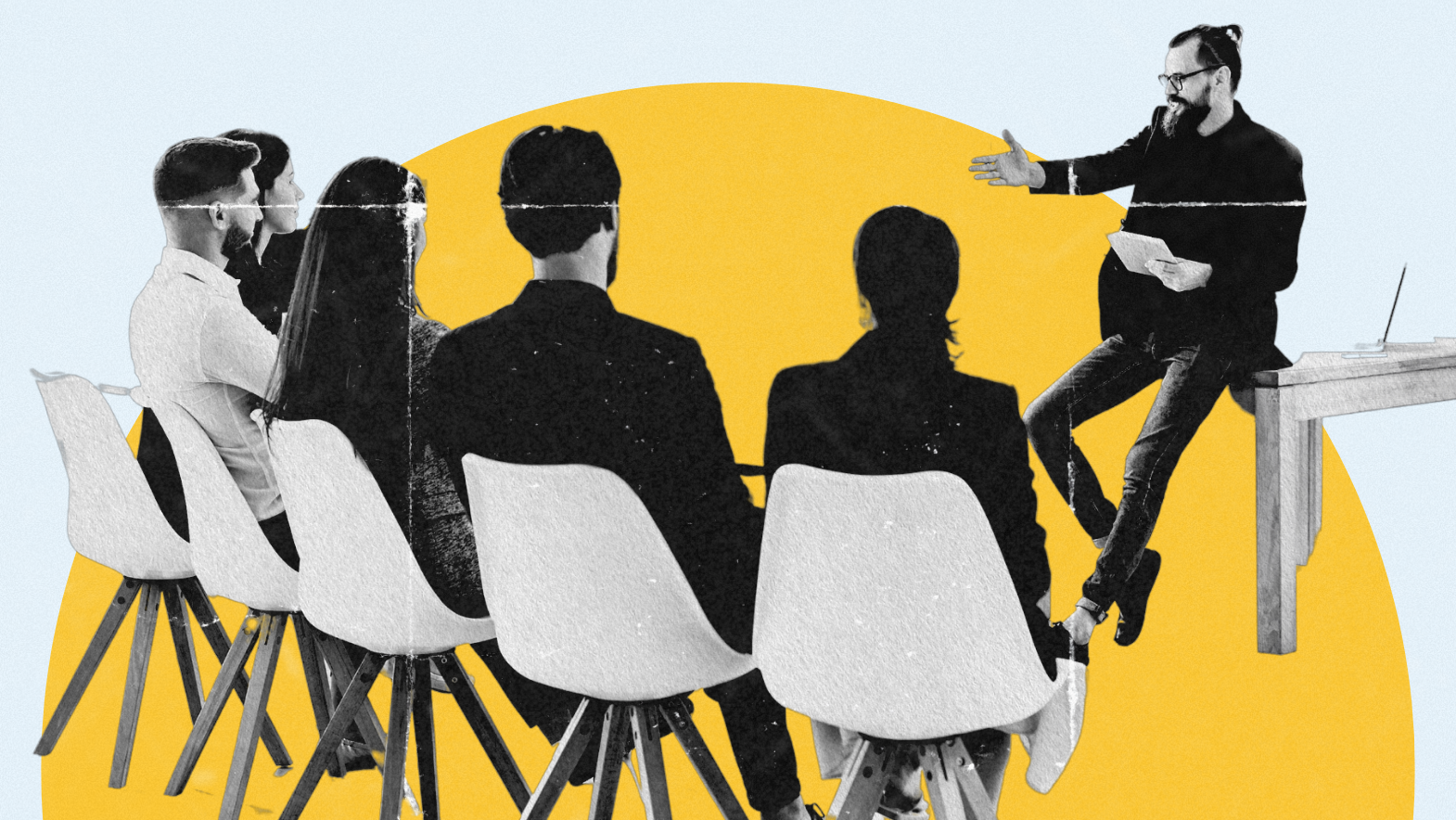A man with glasses and a beard gestures while speaking to a group of five seated professionals during a training or seminar. The presenter sits casually on a desk with notes in hand, set against a modern, abstract yellow and blue background.