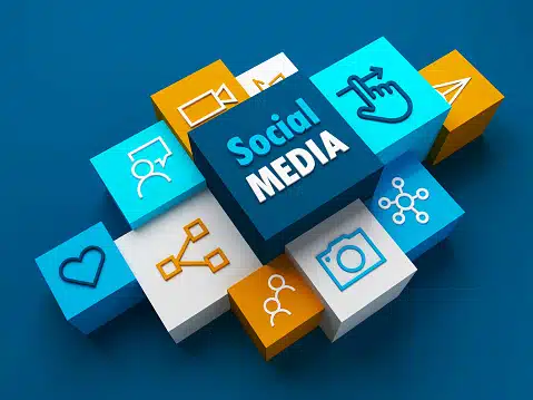 3D blocks with icons representing various online activities surrounding a central block labeled "Social Media," symbolizing social media marketing.