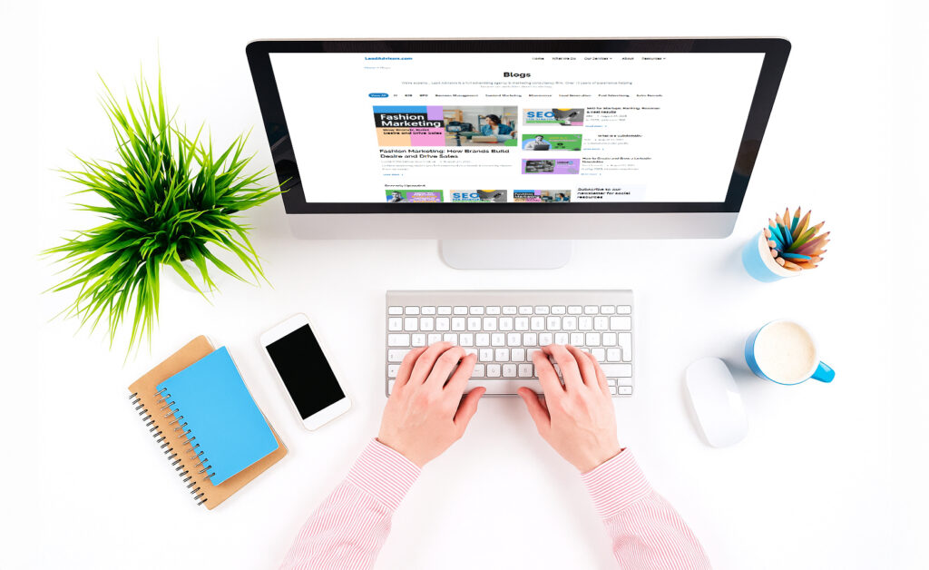 Professional portrait of a focused individual holding a laptop, representing expertise in digital strategy or virtual collaboration at LeadAdvisors