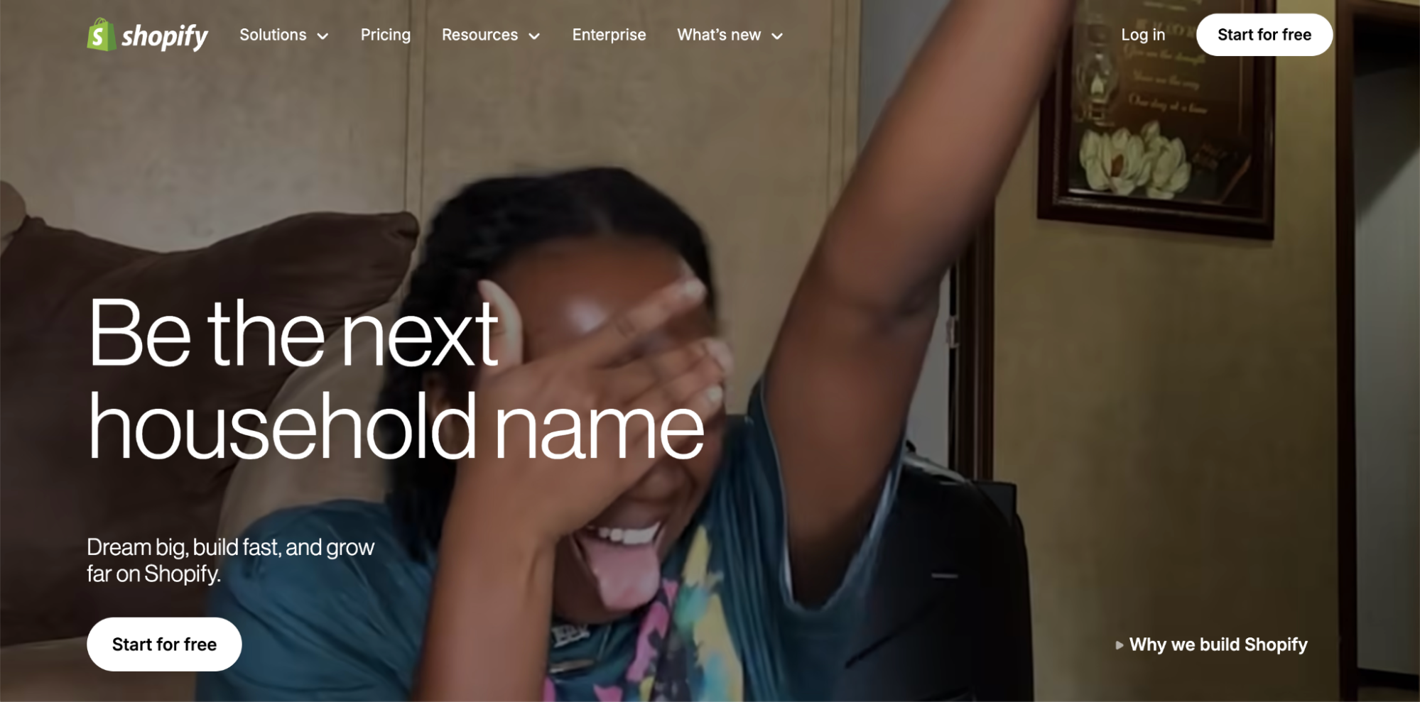 A person smiles joyfully with one arm raised and the other covering their eyes. The text reads, “Be the next household name with Shopify—your go-to choice for Linktree alternatives. Dream big, build fast, and grow far.” Buttons for Start for free are shown.