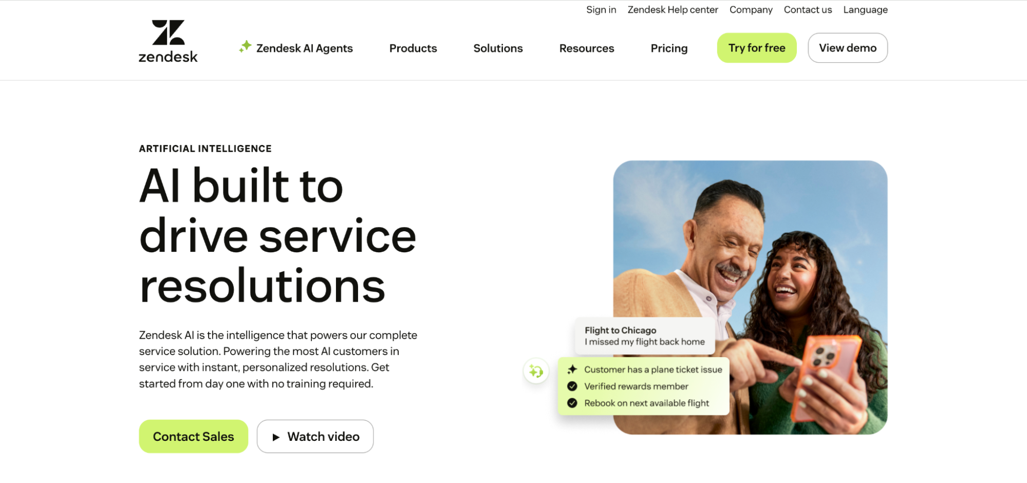 Zendesk AI landing page showing messaging about AI-powered customer service resolutions alongside an image of two people interacting with a mobile phone.