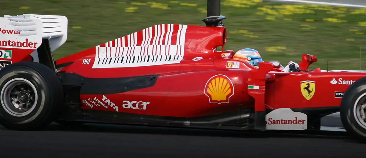 A Ferrari Formula 1 car displays the debated barcode-style livery on its engine cover, which critics claimed resembled subliminal tobacco advertising.