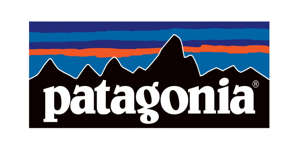The Patagonia logo featuring a white lowercase wordmark over a black mountain silhouette with blue, purple, and orange stripes in the background.
