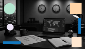 Operations manager's desk at night with three wall clocks showing different time zones, a laptop displaying a global operations map, and a phone — representing 24/7 multi-region BPO coverage across time zones.