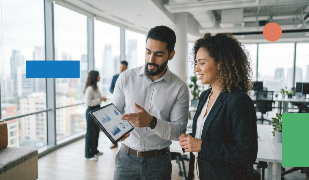 Team reviewing sales performance data in an office setting, representing how sales outsourcing supports pipeline generation and reporting for B2B revenue teams. Illustrates an operator-style approach to tracking outcomes and decision-making.
