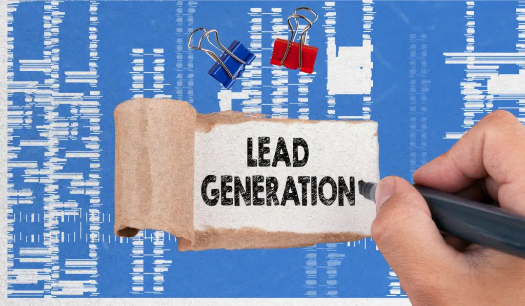 Lead generation concept image with the words ‘Lead Generation’ on paper over an analytics-style background