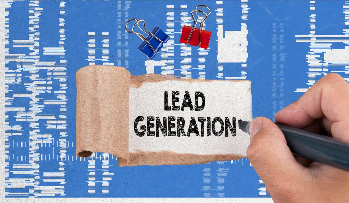 Lead generation concept image with the words ‘Lead Generation’ on paper over an analytics-style background