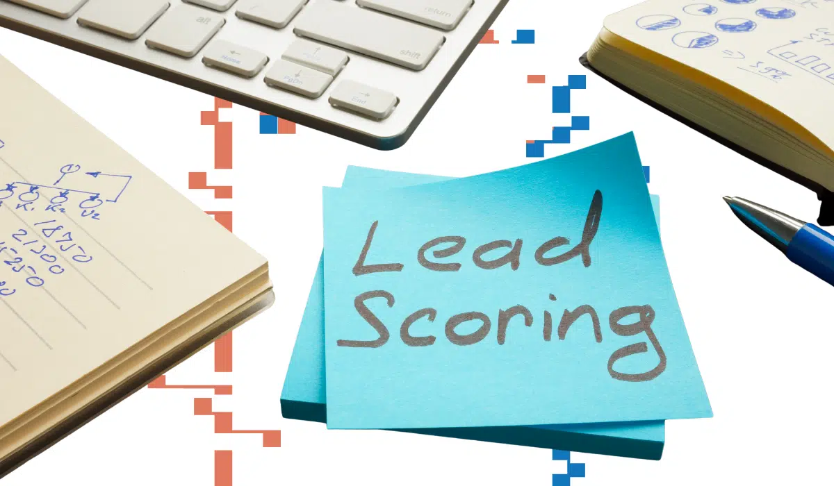 Lead scoring concept image with a sticky note labeled ‘Lead Scoring’ alongside notes and planning tools