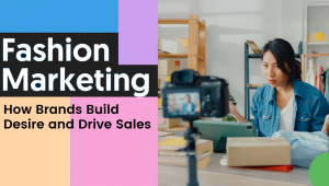 A woman in a denim shirt speaks in front of a camera with clothing and packages on the table. The text reads “Fashion Marketing: How Brands Build Desire and Drive Sales” on a colorful, modern background.